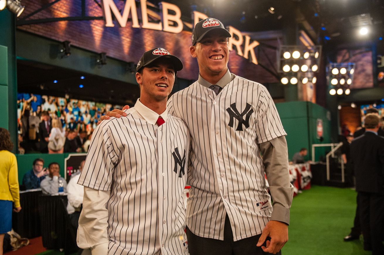 Ian Clarkin stands with Aaron Judge, both wearing Yankees jerseys, after they were taken with consecutive picks by the Yankees in the 2013 draft