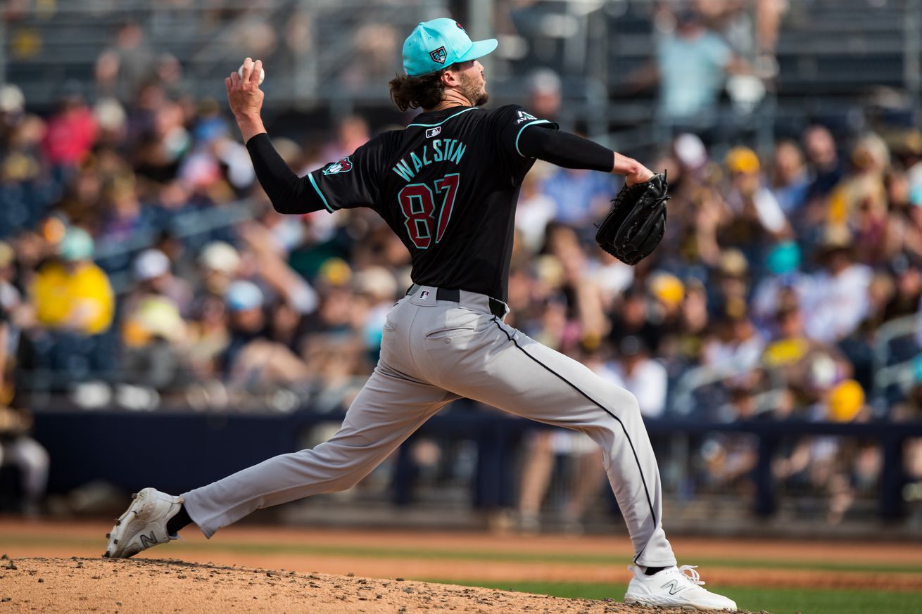 Left handed pitcher Blake Walston, wearing a black jersey and teal cap, throws a pitch