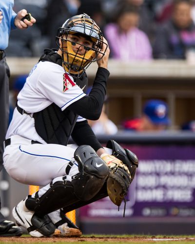 Caleb Roberts crouches behind home plate
