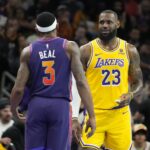 LeBron James (Los Angeles Lakers) and Bradley Beal (Phoenix Suns) speak on the court