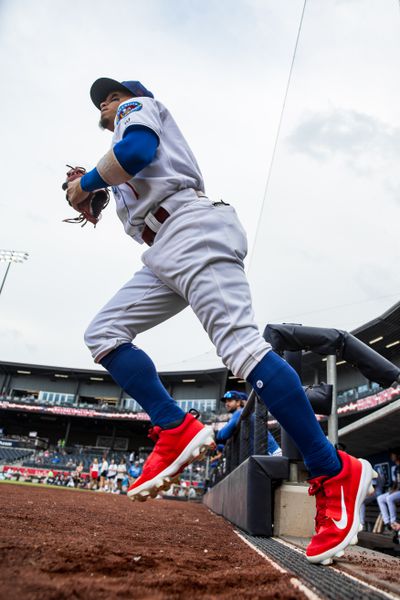 Jancarlos Cintron runs out of the dugout to take his position.