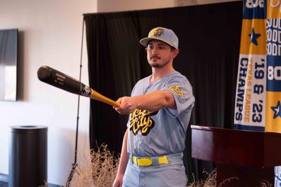 Cole Mayberry gestures with a baseball bat while wearing the Yellow City Pigweeds uniform, which is powder blue with yellow letters and a yellow belt. Syndication: Amarillo Globe-News