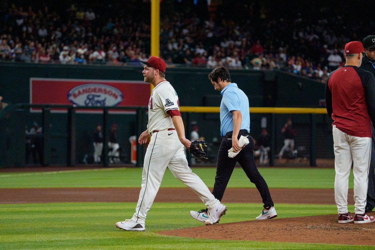 Burnes walks off the mound after destroying his elbow