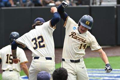 Conner Cunningham, a freshman, celebrates a seventh inning home run that capped a nine-run inning