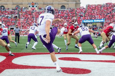 Kubiuk (#17) punts for Northwestern against Wisconsin in 2019