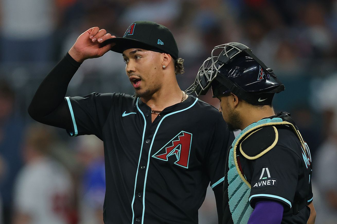 Martinez and Moreno talk after strike out.