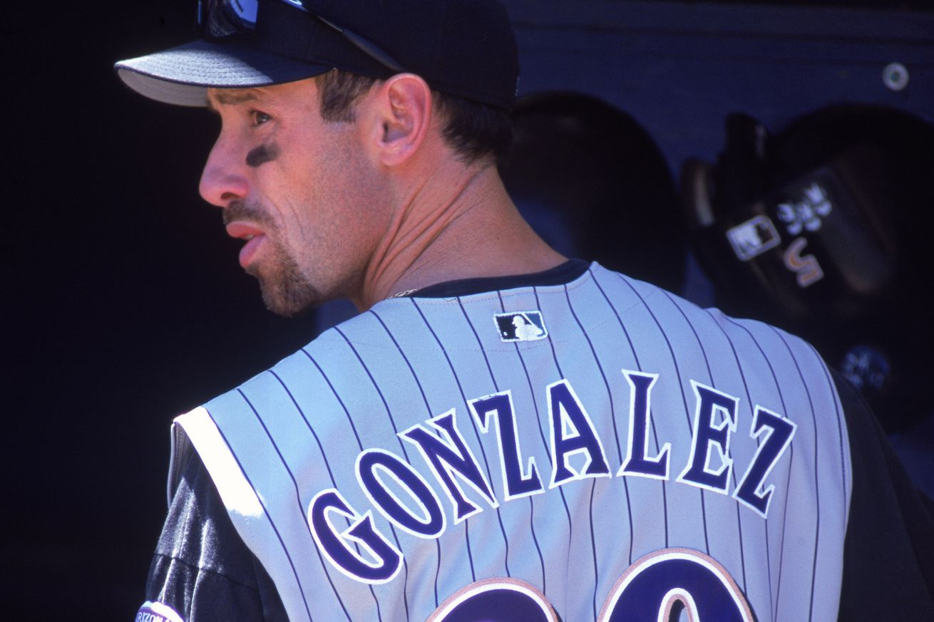Luis Gonzalez turns to look out onto the field from the dugout